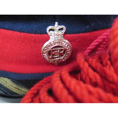 537 - A tin helmet, sash, two Merchant Navy peaked caps, household Cavalry peaked cap and Spanish beret