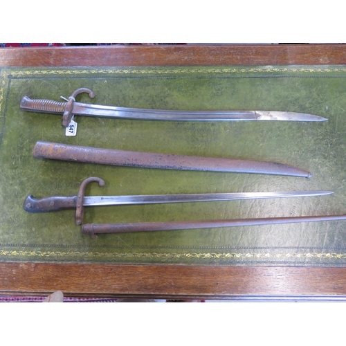 547 - A French 1848 patent bayonet and another bayonet with curved blade - both with pitting and rust to s... 