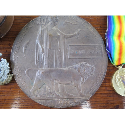 554 - A World War I 1914/18 Medal, Victory Medal and Death Plaque awarded to 33108 Pte G. Argent Boarder R... 