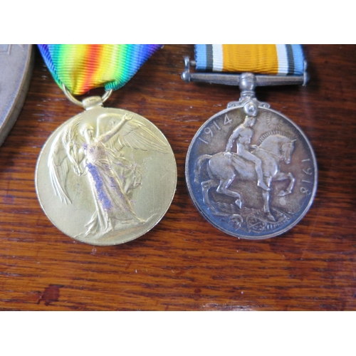 554 - A World War I 1914/18 Medal, Victory Medal and Death Plaque awarded to 33108 Pte G. Argent Boarder R... 