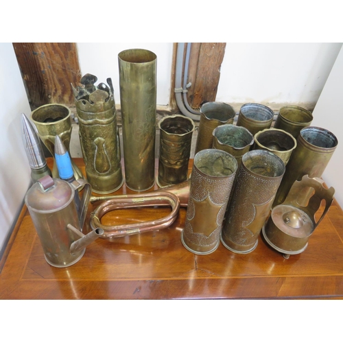 561 - A selection of gun shells, some converted to trench art and a bugle