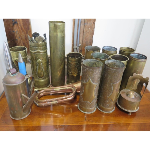 561 - A selection of gun shells, some converted to trench art and a bugle