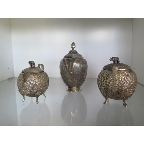 665 - An Indian silver teapot - Height 15cm - and a small Indian silver teapot and a lidded bowl - total s... 