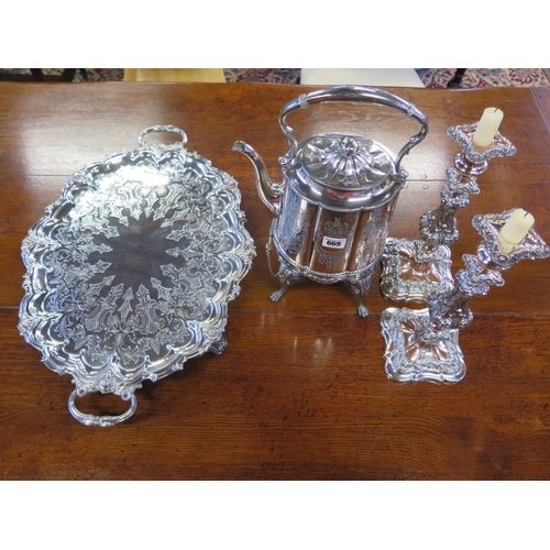 669 - A pair of ornate Sheffield plate candlesticks and a plated tea kettle on stand with spirit burner an... 