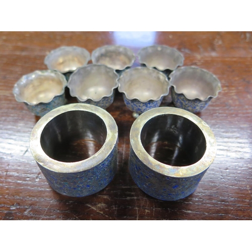 691 - Two Chinese white metal napkin rings and seven small bowls both with enameled decoration - approx to... 