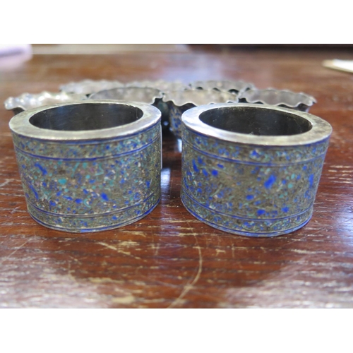 691 - Two Chinese white metal napkin rings and seven small bowls both with enameled decoration - approx to... 