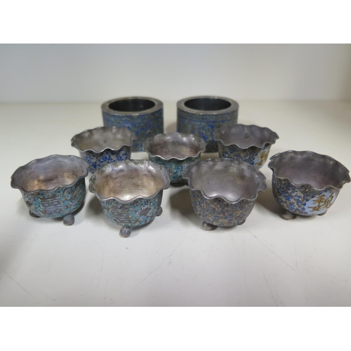 691 - Two Chinese white metal napkin rings and seven small bowls both with enameled decoration - approx to... 