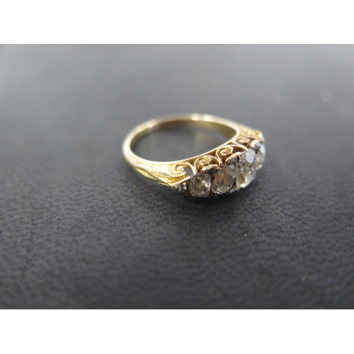 751 - A yellow gold five stone diamond ring with ten smaller diamonds set to the outer edge - ring size P ... 