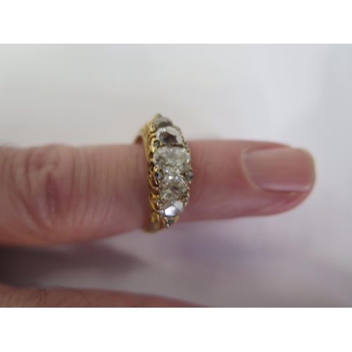 751 - A yellow gold five stone diamond ring with ten smaller diamonds set to the outer edge - ring size P ... 