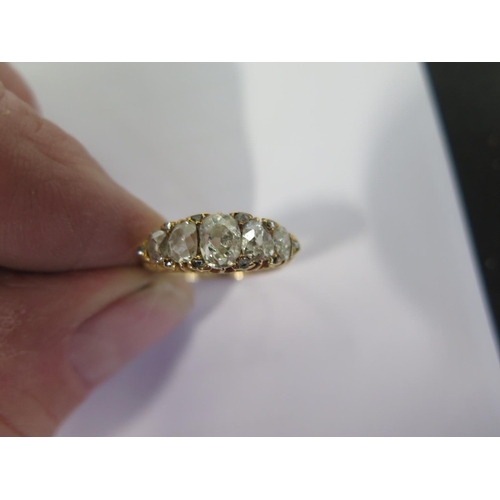 751 - A yellow gold five stone diamond ring with ten smaller diamonds set to the outer edge - ring size P ... 