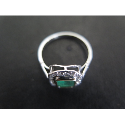 753 - An 18ct white gold emerald and diamond ring size N - approx weight 2.8 grams - some light usage wear... 