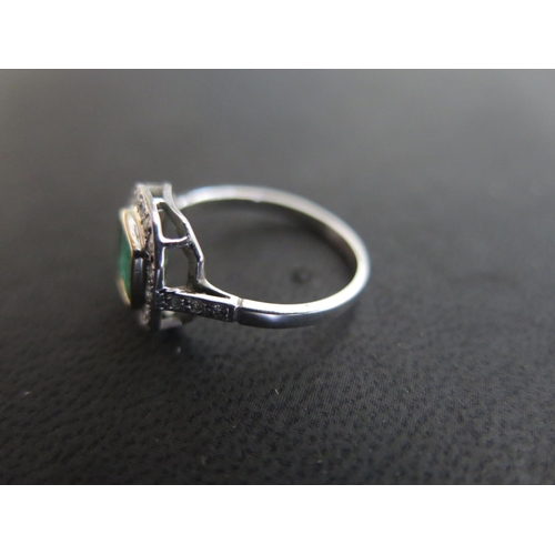 753 - An 18ct white gold emerald and diamond ring size N - approx weight 2.8 grams - some light usage wear... 