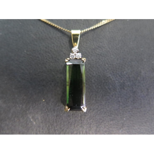 754 - An 18ct yellow gold tourmaline and diamond pendant on a 9ct yellow gold chain - Length approx 48cm -... 