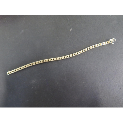 755 - A 14ct yellow gold emerald bracelet set with small diamonds - Length 18cm - approx weight 12.8 grams... 