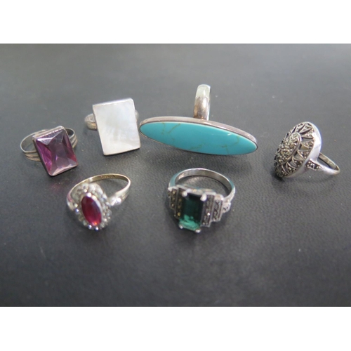 769 - Six silver rings, various sizes and design - turquoise, red paste, marcasite, green paste, amethyst ... 