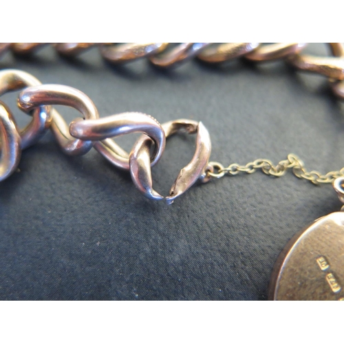 770 - A 9ct rose gold bracelet, chain link with heart shaped clasp - approx weight 11.9 grams