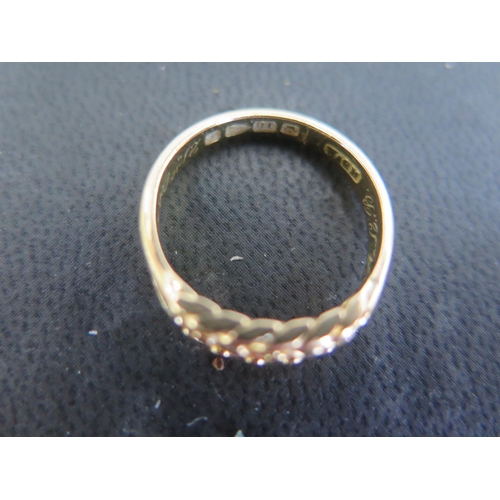 783 - An 18ct yellow gold ring size N - pierced weave design to shoulder - approx weight 4.8 grams - in go... 