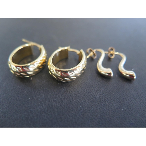 786 - Two pairs of 9ct yellow gold earrings, one pair of hoop form, one pair of horn form - total approx w... 