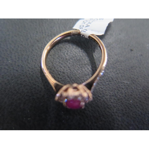 790 - A 9ct yellow gold ruby and diamond ring size M - approx weight 2.2 grams - ex jewellers stock, in ne... 