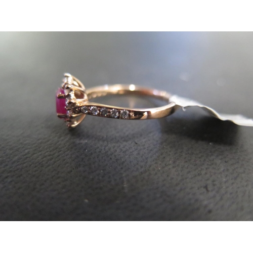 790 - A 9ct yellow gold ruby and diamond ring size M - approx weight 2.2 grams - ex jewellers stock, in ne... 