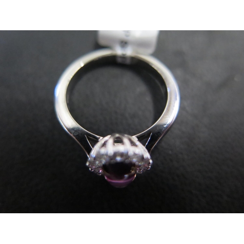 808 - An 18ct white gold cabochon purple sapphire and diamond cluster ring - approx weight 1.08ct - ring s... 