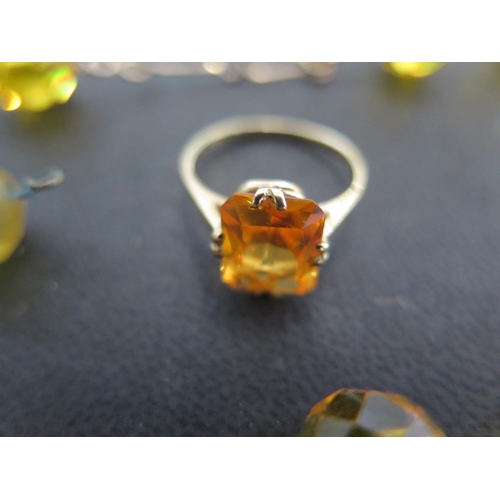 814 - A 14ct yellow gold ring marked 585 with rectangular cut citrine to shoulder with a yellow glass neck... 