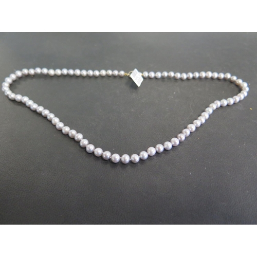 821 - A string of grey pearls - Length 46cm - pearls range from 5mm to 5.5mm with a 9ct clasp - ex jewelle... 