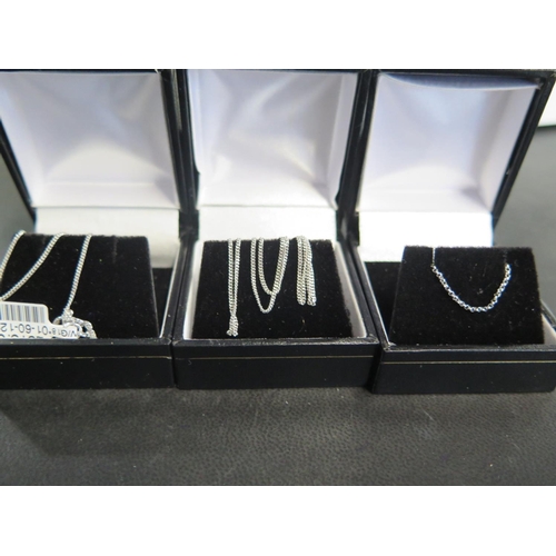 825 - Two 18ct white gold chains - 45cm and 40cm long - total approx weight 4 grams and a 9ct white gold c... 