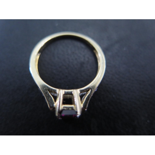 841 - A 14ct yellow gold garnet and diamond ring size N/O - approx weight 3.3 grams - some light scratches... 