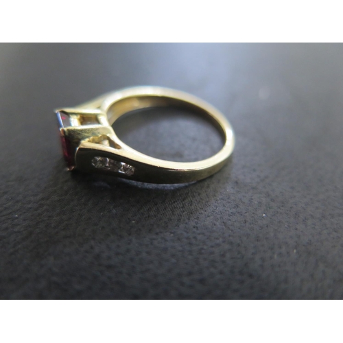 841 - A 14ct yellow gold garnet and diamond ring size N/O - approx weight 3.3 grams - some light scratches... 