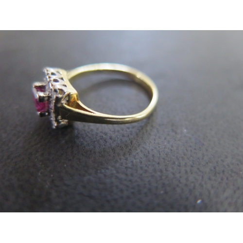 853 - An 18ct yellow gold pink sapphire and diamond ring size L/M - approx weight 2.7 grams - the square c... 