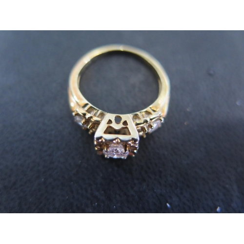 865 - A 14ct yellow gold three stone diamond ring size L - weight approx 3.8 grams - some light scratches,... 