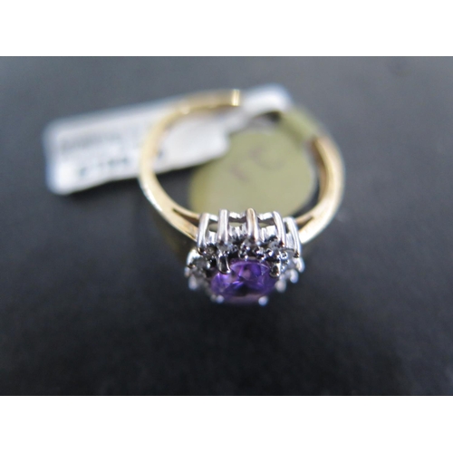 886 - A 9ct yellow gold amethyst and diamond cluster ring size M/N - approx weight 2.4 grams - in good con... 