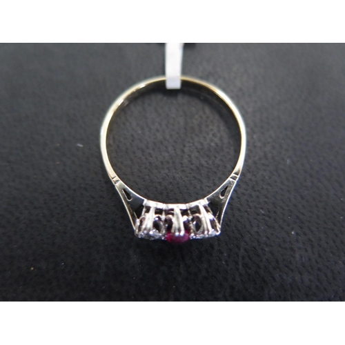 887 - An 18ct yellow gold and platinum ruby and diamond ring size S/T - approx weight 2.1 grams - some lig... 