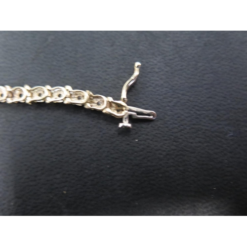 899 - A 9ct yellow gold and diamond bracelet - Length 18.5cm - approx weight 7.5 grams - in good bright co... 