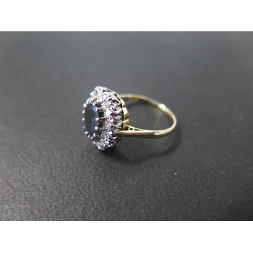 905 - An 18ct yellow gold Burmese sapphire and diamond ring - The central sapphire approx 7.5mm x 9mm x 3.... 