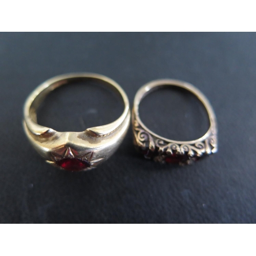 929 - A 9ct yellow gold and garnet ring size Q/R - approx weight 3.8 grams and a 9ct yellow gold three sto... 