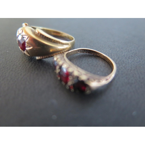 929 - A 9ct yellow gold and garnet ring size Q/R - approx weight 3.8 grams and a 9ct yellow gold three sto... 