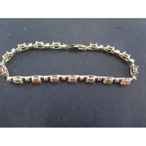 930 - A 9ct gold bracelet set with sapphire and alexandrite stones - approx 20 cm in length - total weight... 