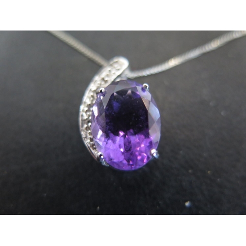 932 - A 9ct white gold amethyst and white topaz pendant on chain - chain length approx 48cm - total weight... 