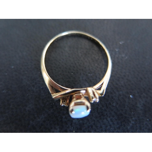 938 - A 14ct gold opal and diamond ring size P - approx weight 2.1 grams - very light scratches, usage wea... 