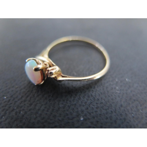 938 - A 14ct gold opal and diamond ring size P - approx weight 2.1 grams - very light scratches, usage wea... 