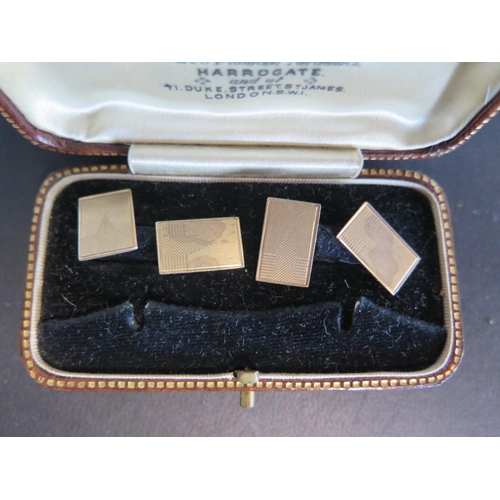 942 - A pair of 9ct gold Art Deco style cufflinks with engine turned decoration - approx weight 5.5 grams ... 