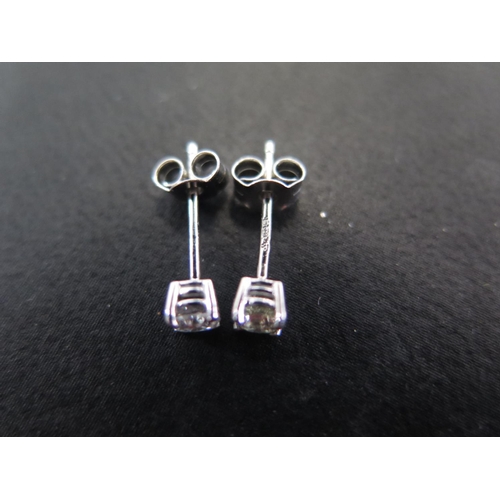 943 - A pair of hallmarked 950 platinum and diamond earrings - approx total diamond weight 0.25ct