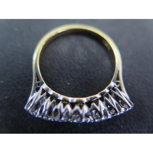 950 - An 18ct yellow gold and seven stone diamond ring size P - approx weight 3.7 grams - surface scratche... 