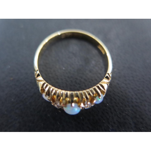 951 - An 18ct yellow gold opal and diamond ring size Q/R - approx weight 3.2 grams - some very light scrat... 