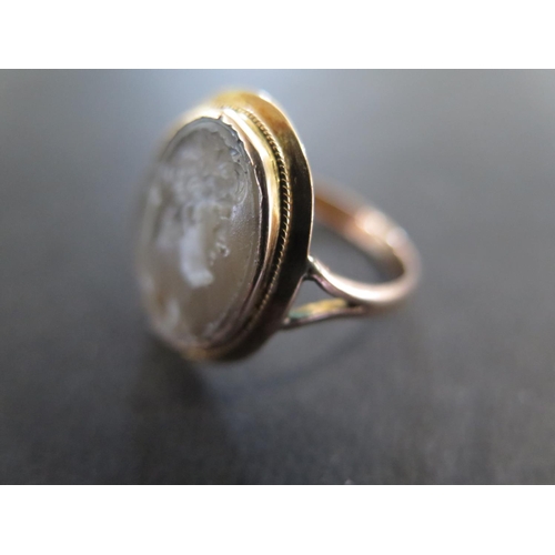 953 - A presumed 9ct rose gold cameo ring size P - approx weight 3.6 grams - light scratches, usage wear