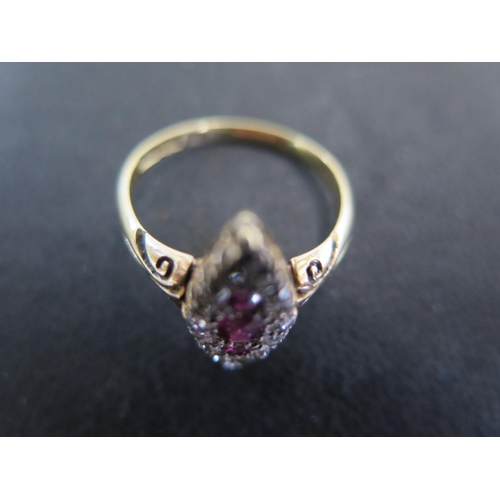 956 - An 18ct yellow gold diamond and ruby navette shaped ring size N/O - approx weight 3.2 grams - some l... 