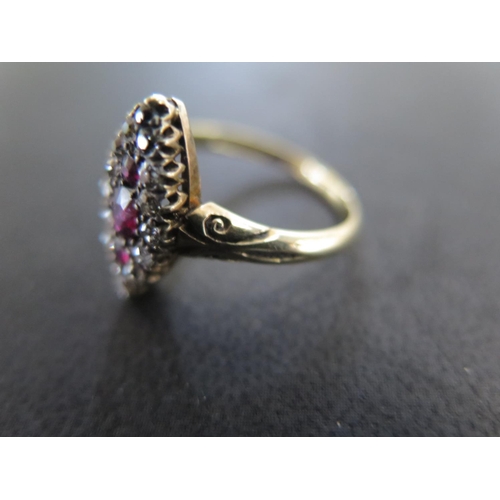 956 - An 18ct yellow gold diamond and ruby navette shaped ring size N/O - approx weight 3.2 grams - some l... 