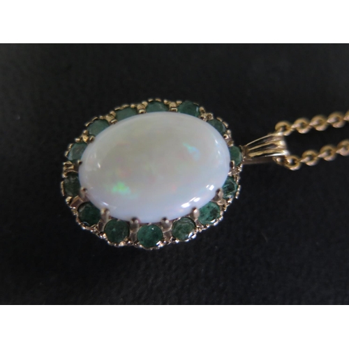 959 - A 9ct opal pendant on a 9ct gold chain - Length 45cm - total weight approx 7 grams